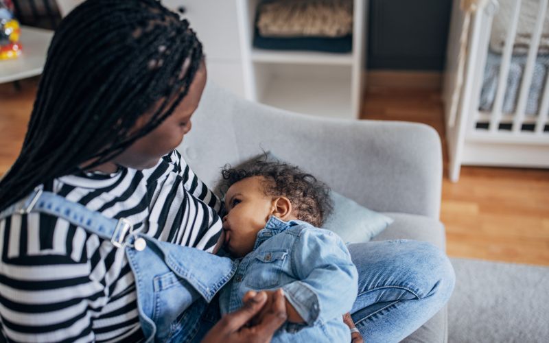 woman breastfeeding an infant